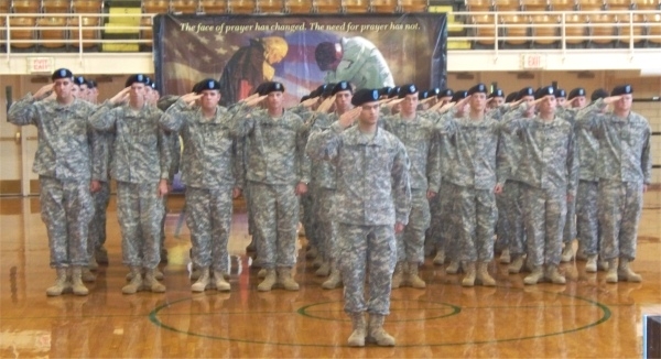 The Salem National Guard unit gives a salute at their deployment ceremony Saturday, August 23 at Salem Community High School. 
